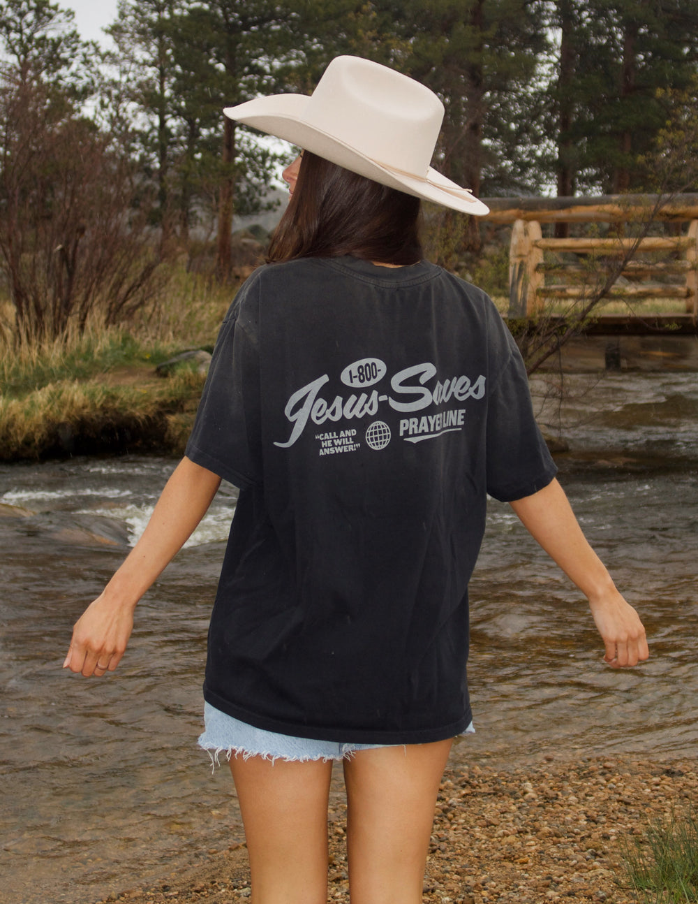 Black unisex T-shirt back view with 'Jesus Saves' prayer line graphic