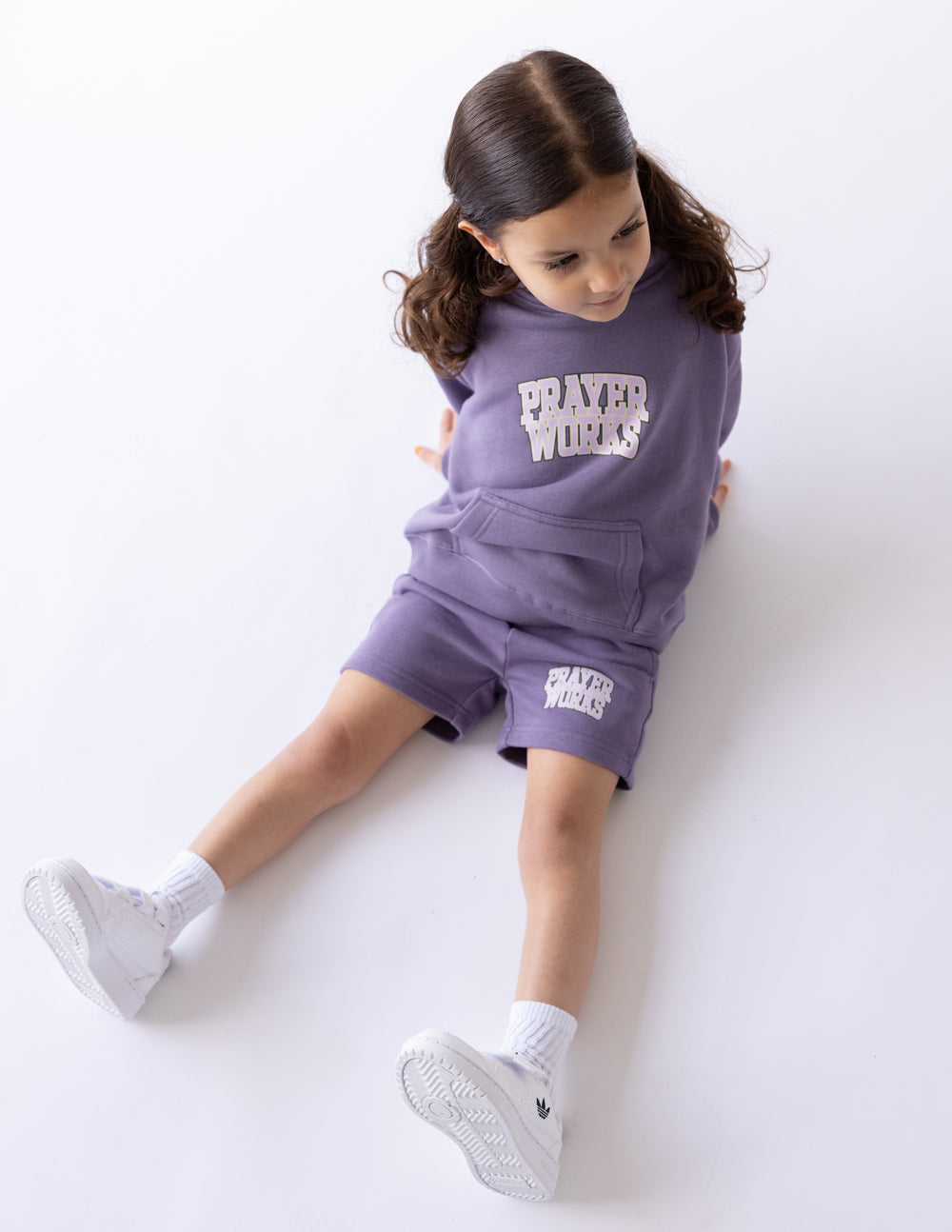 Kids purple short with PRAYER WORKS logo on left leg
