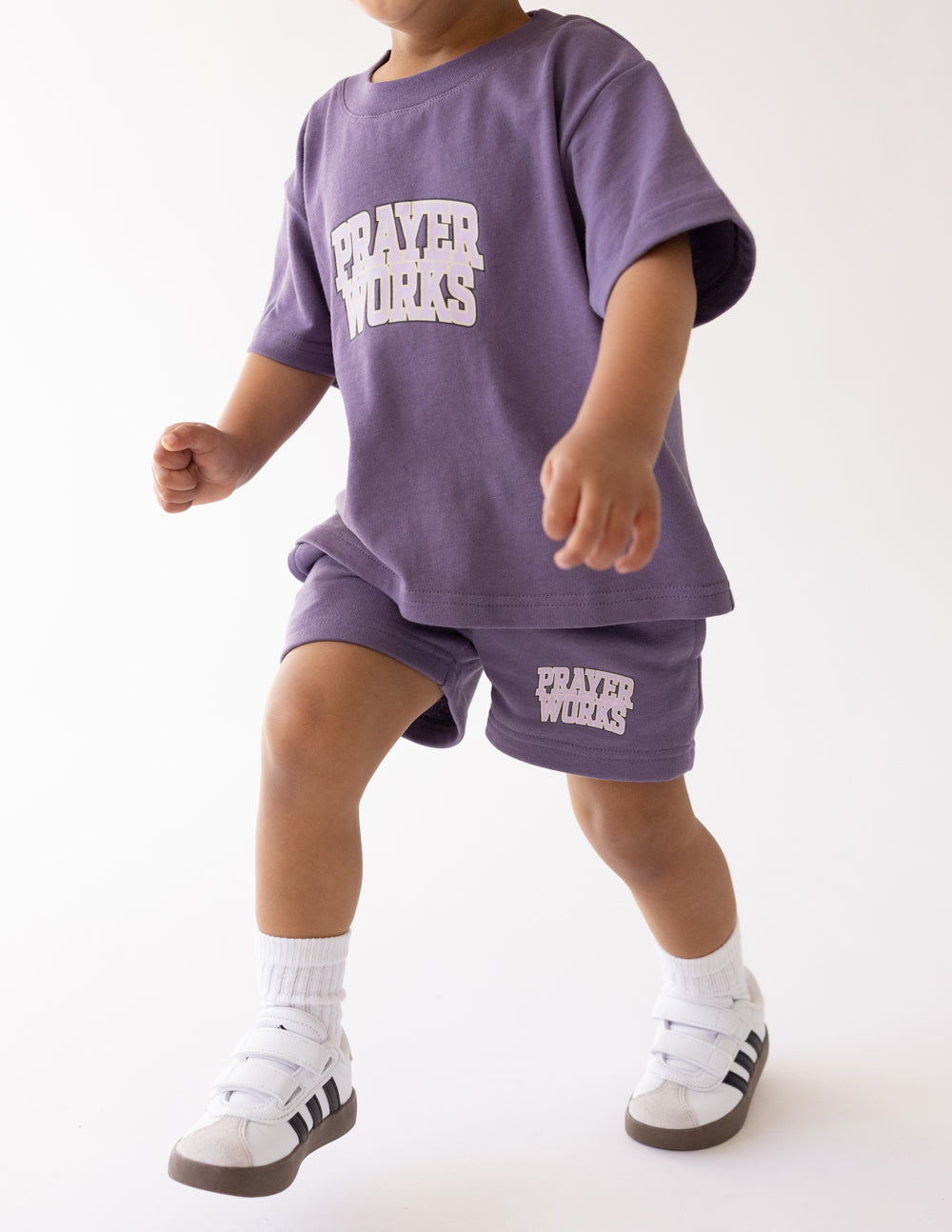Kids purple T-shirt with 'PRAYER WORKS' graphic on chest