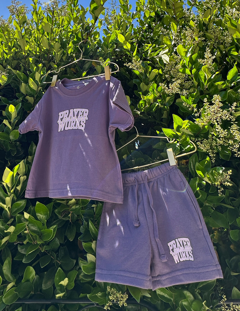 Purple kids T-shirt with 'PRAYER WORKS' chest graphic, short sleeves