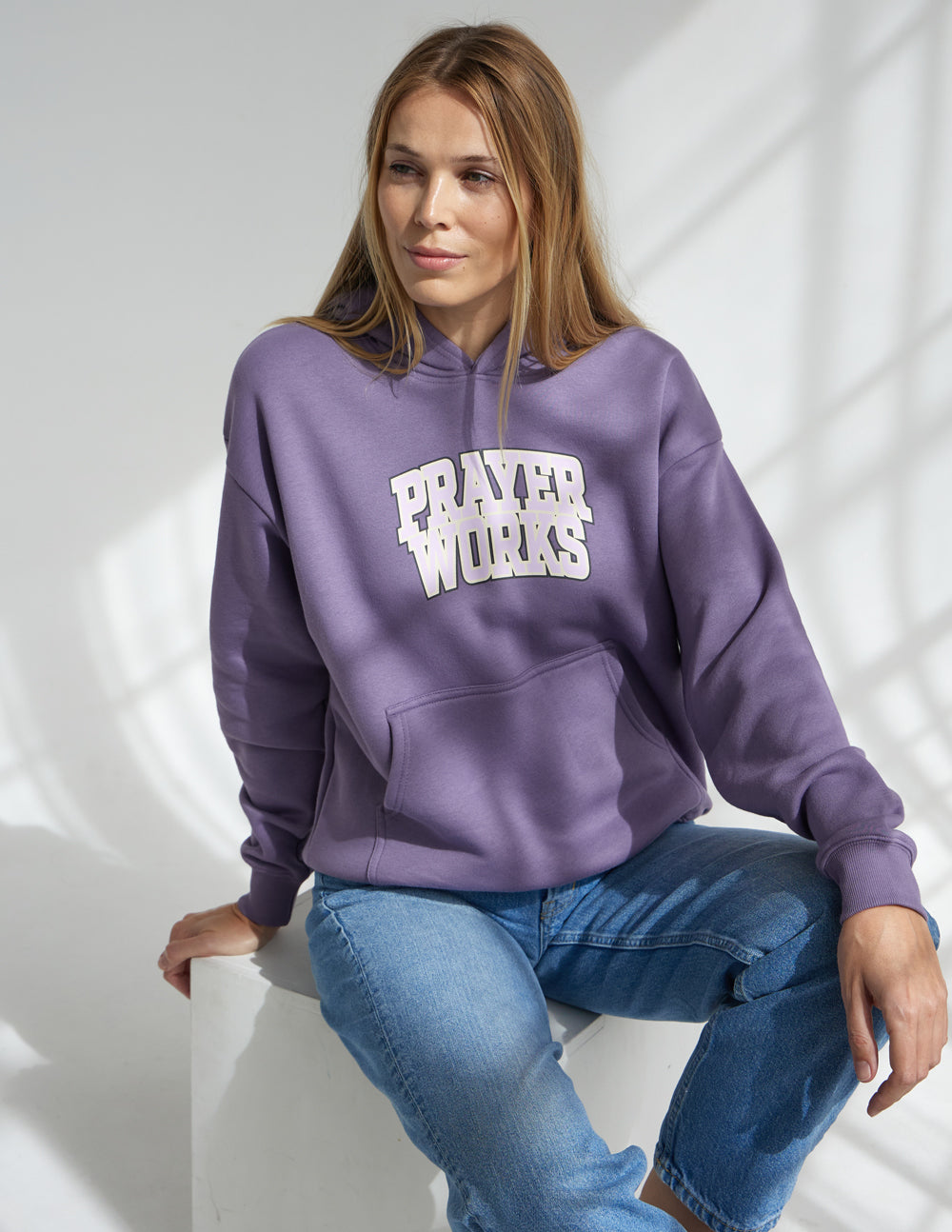Lavender unisex hoodie with "Prayer Works" logo and kangaroo pocket