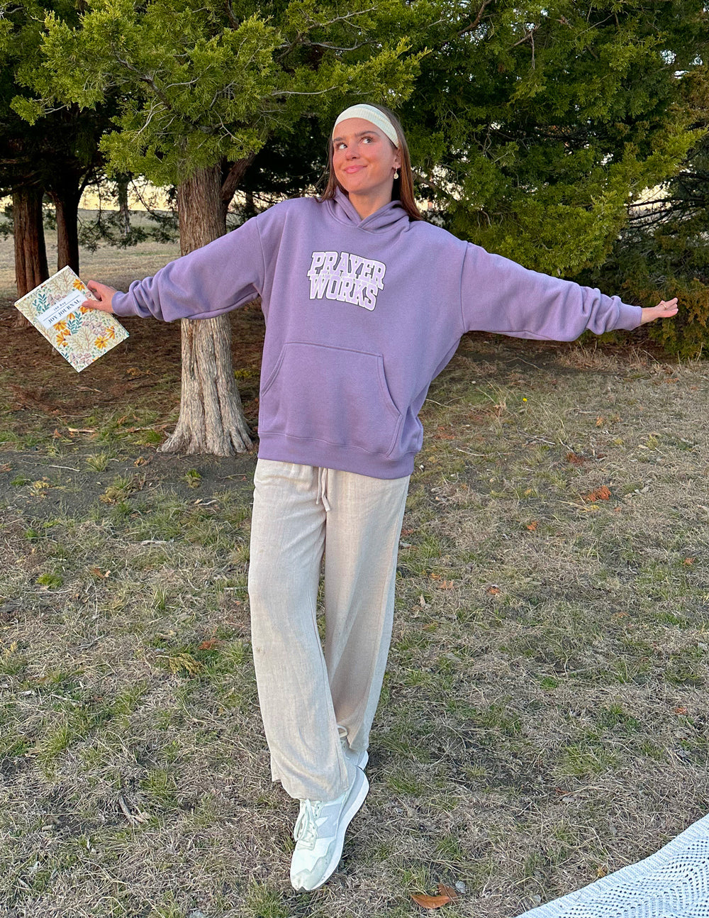 Lavender unisex hoodie with "Prayer Works" graphic and drawstring hood