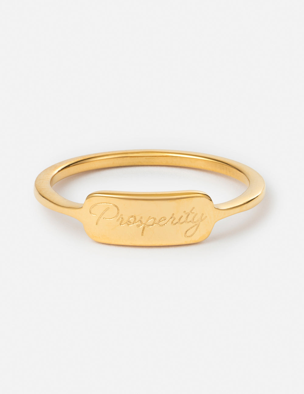 Gold signet ring with arched band and engraved “Prosperity” front