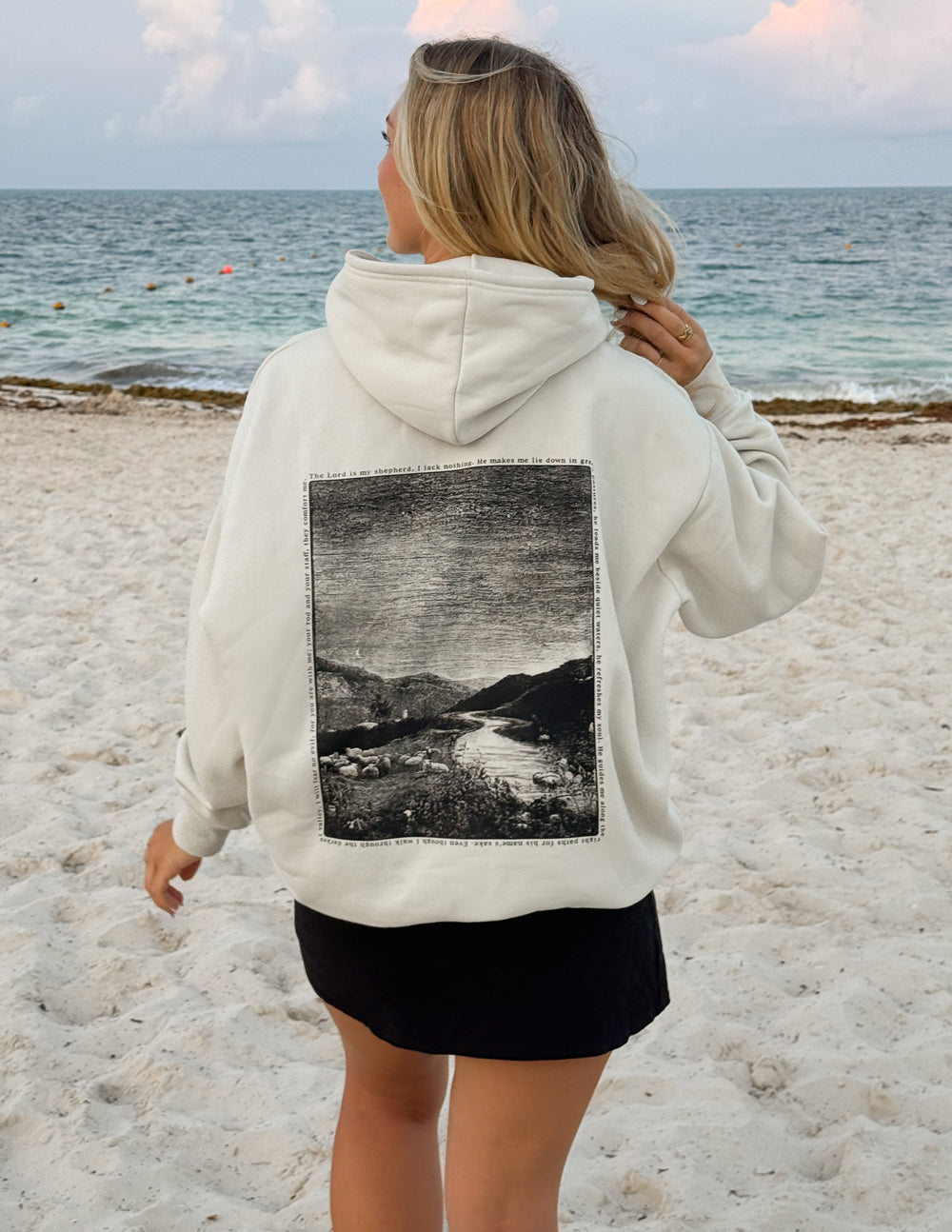 Off-white unisex hoodie, back view with black photo graphic under hood