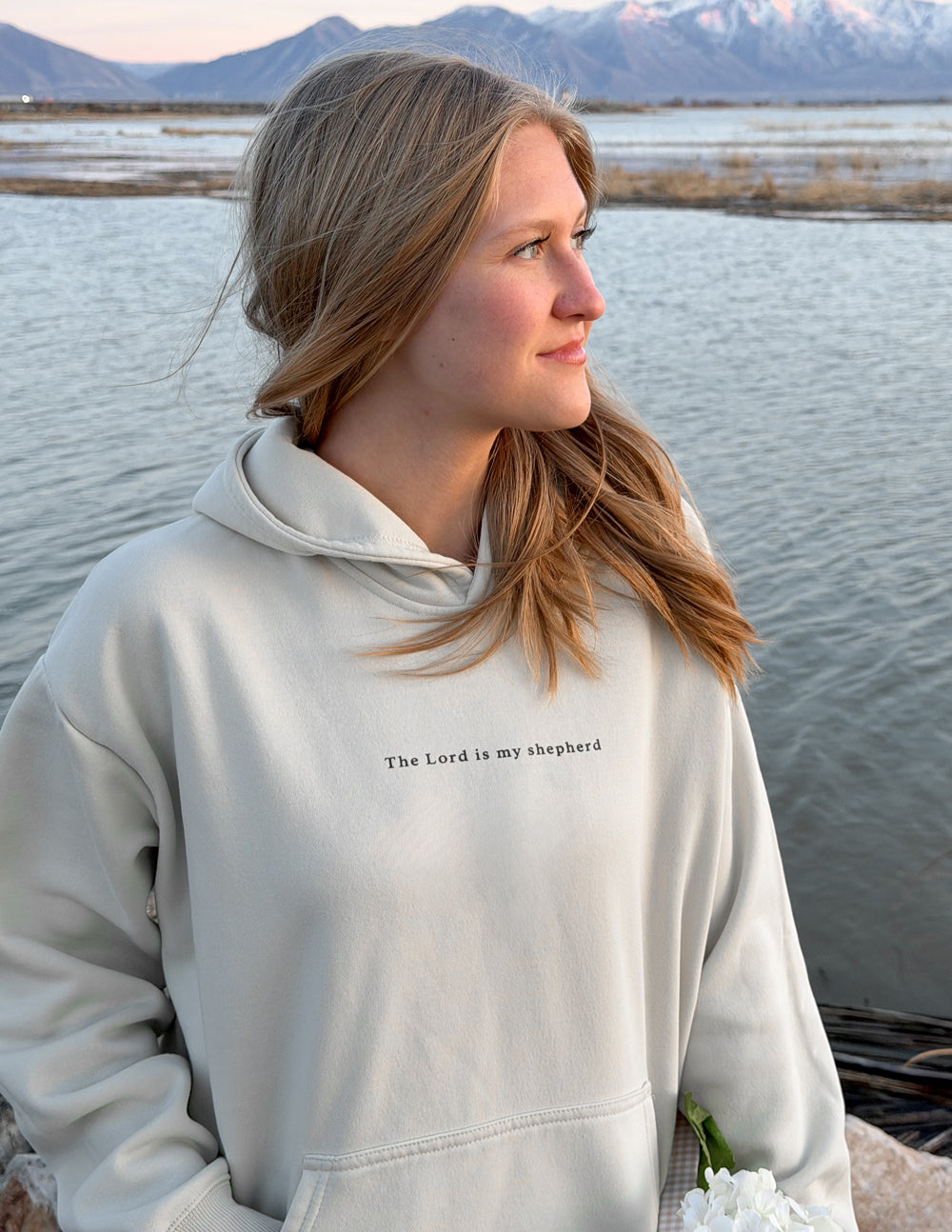 Off-white unisex hoodie with hooded neckline and small chest text
