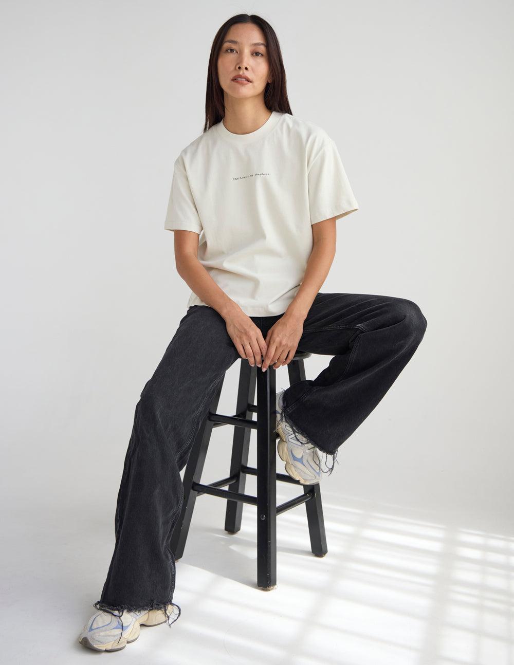 Cream unisex T-shirt with small chest print; short sleeves