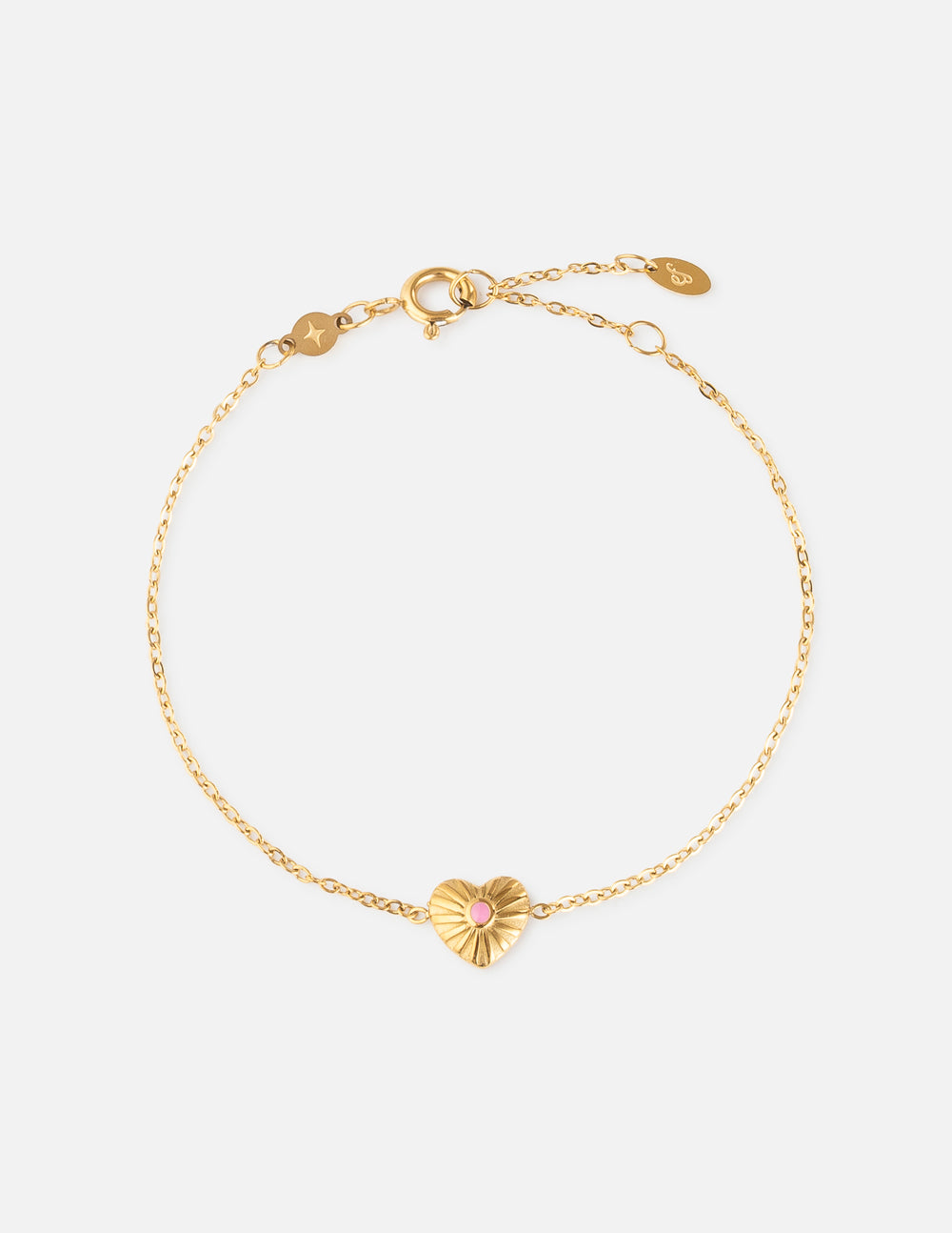Gold link bracelet with pink heart charm and small extender chain
