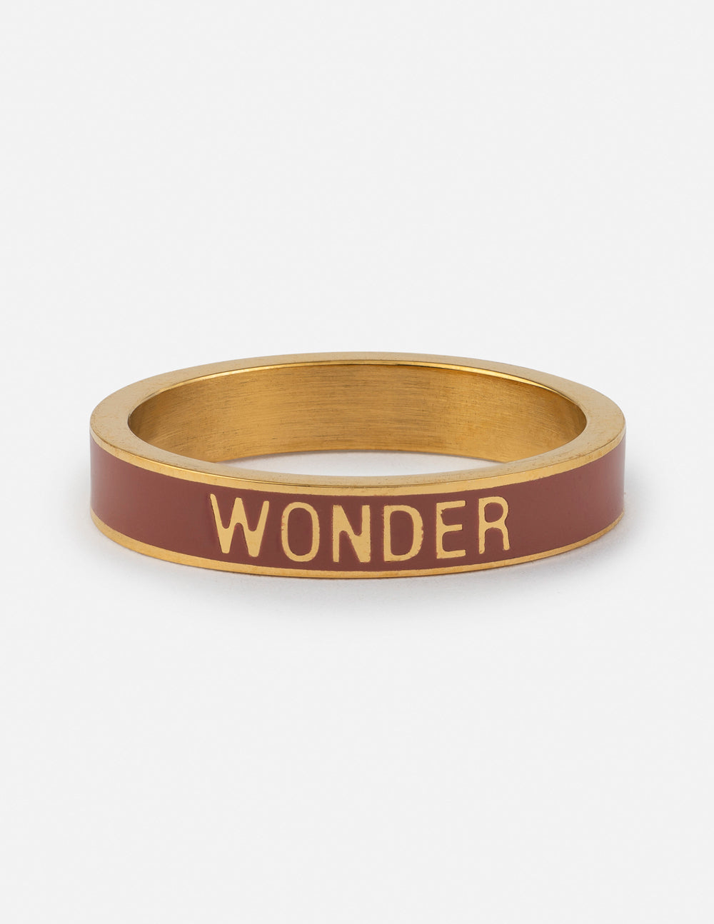 Mauve enamel wonder ring with gold-tone bezel and 'WONDER' engraving