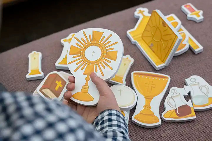 Catholic mass learning toy set with chalice, cross, and communion host pieces