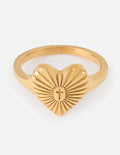 Gold heart signet ring with radiant rays and cross centerpiece