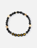 Renew letter bracelet with black faceted beads, gold star spacers, and RENEW lettering