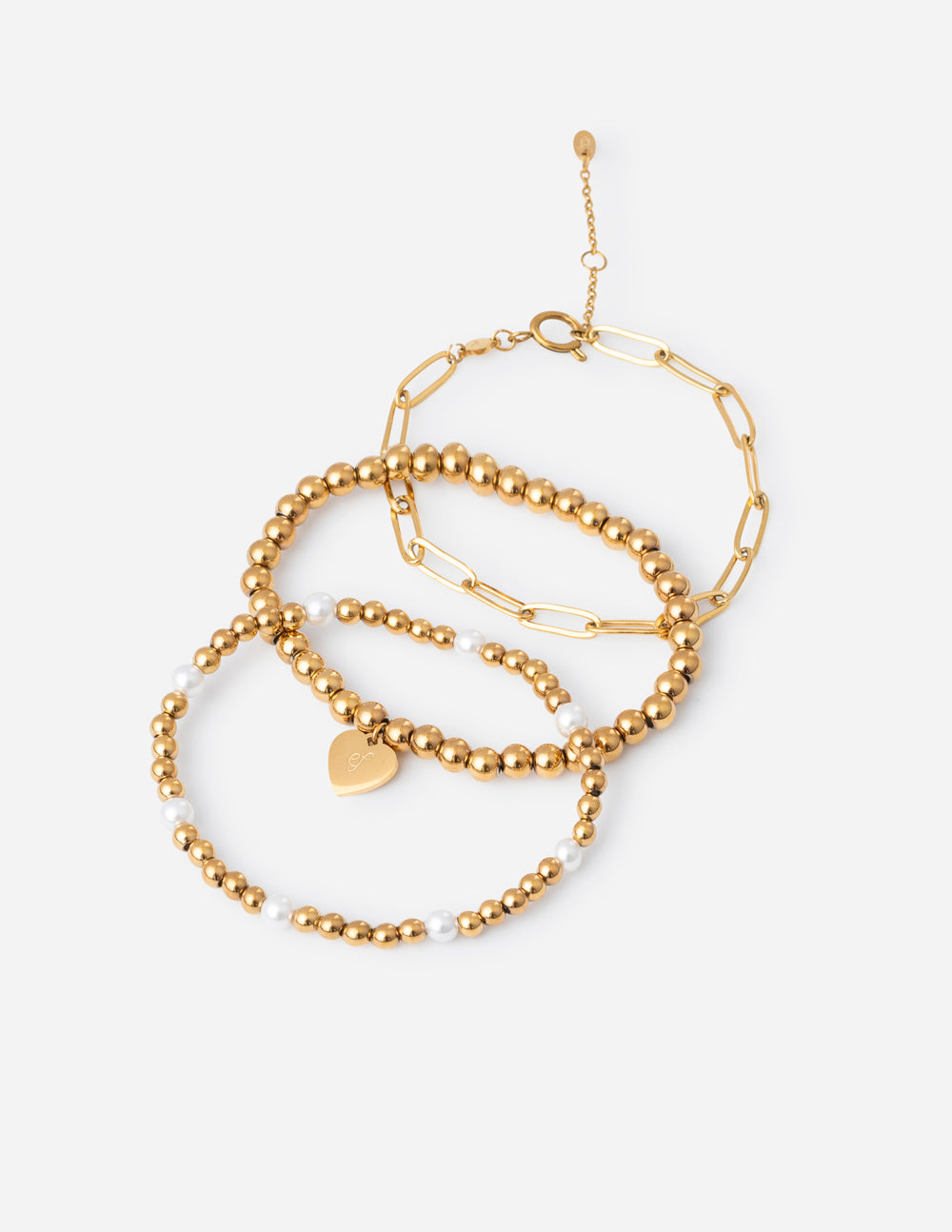 Gold-tone beaded bracelet pack with heart charm and linked chain details