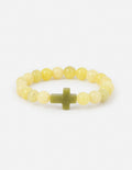 Light yellow beaded bracelet with small green cross charm