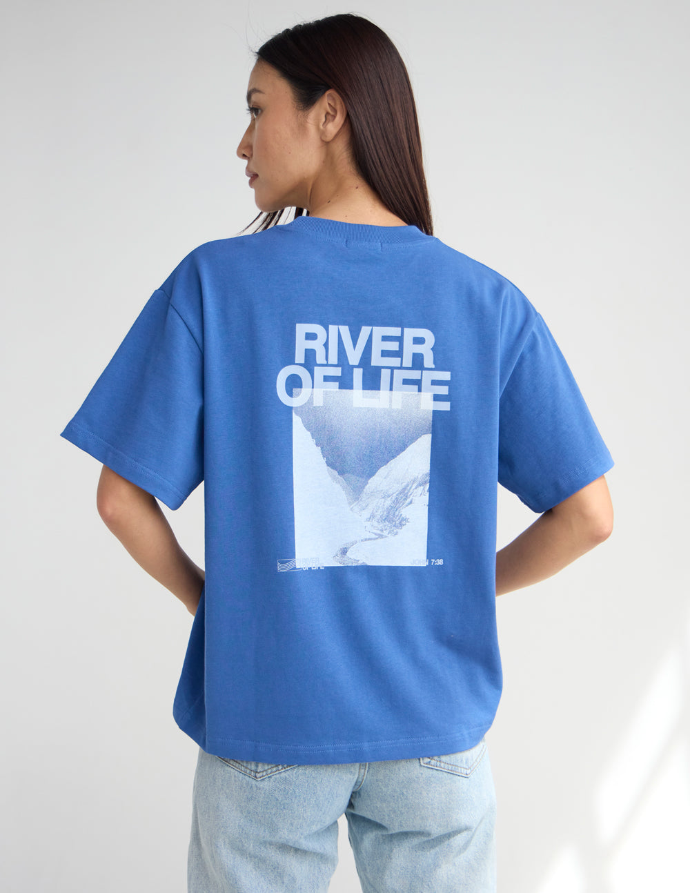 Blue crew-neck graphic T-shirt, back print with River of Life logo and dove