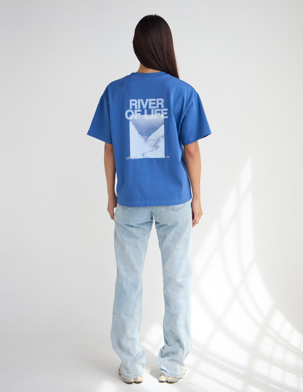 Blue crew-neck graphic T-shirt, back print with River of Life logo and square photo