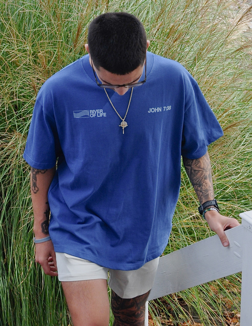 Blue crew-neck graphic T-shirt with River of Life emblem and John 7:38 on chest