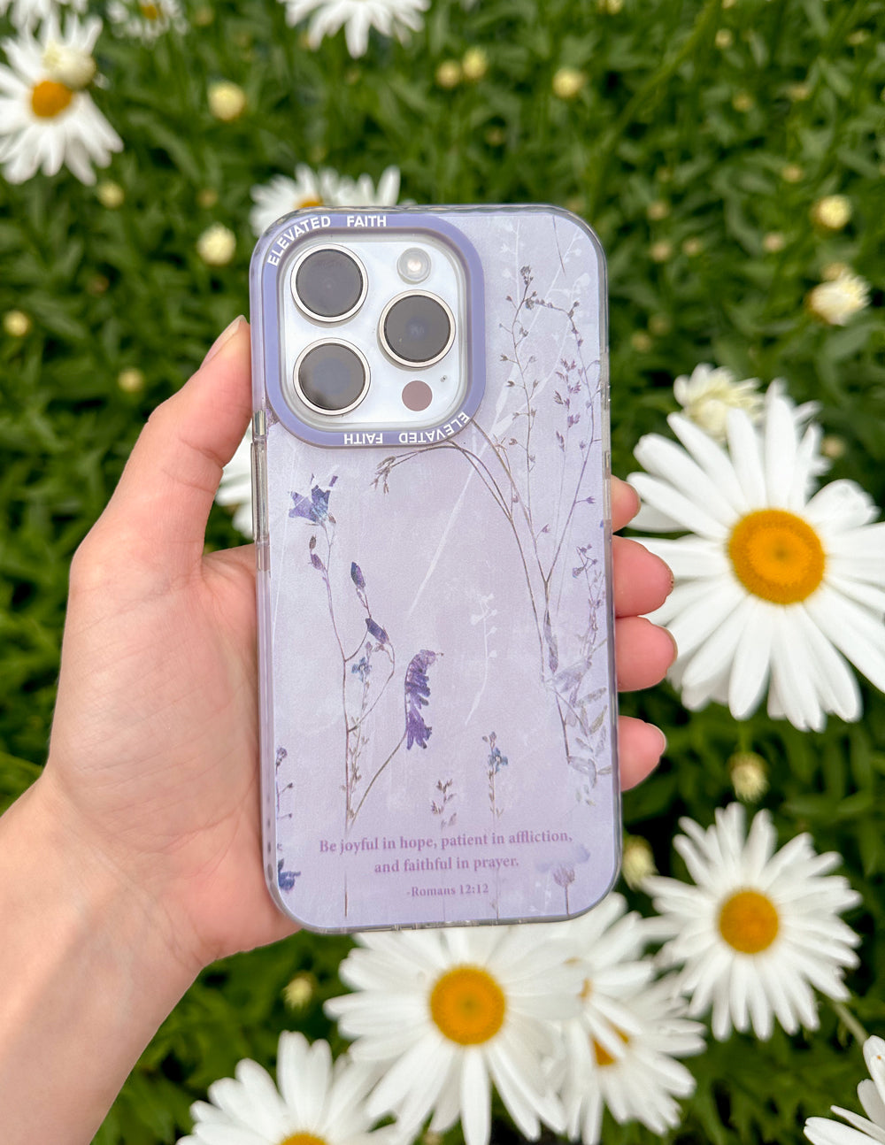 Lavender phone case featuring blue bird silhouettes, floral branches, and text at bottom