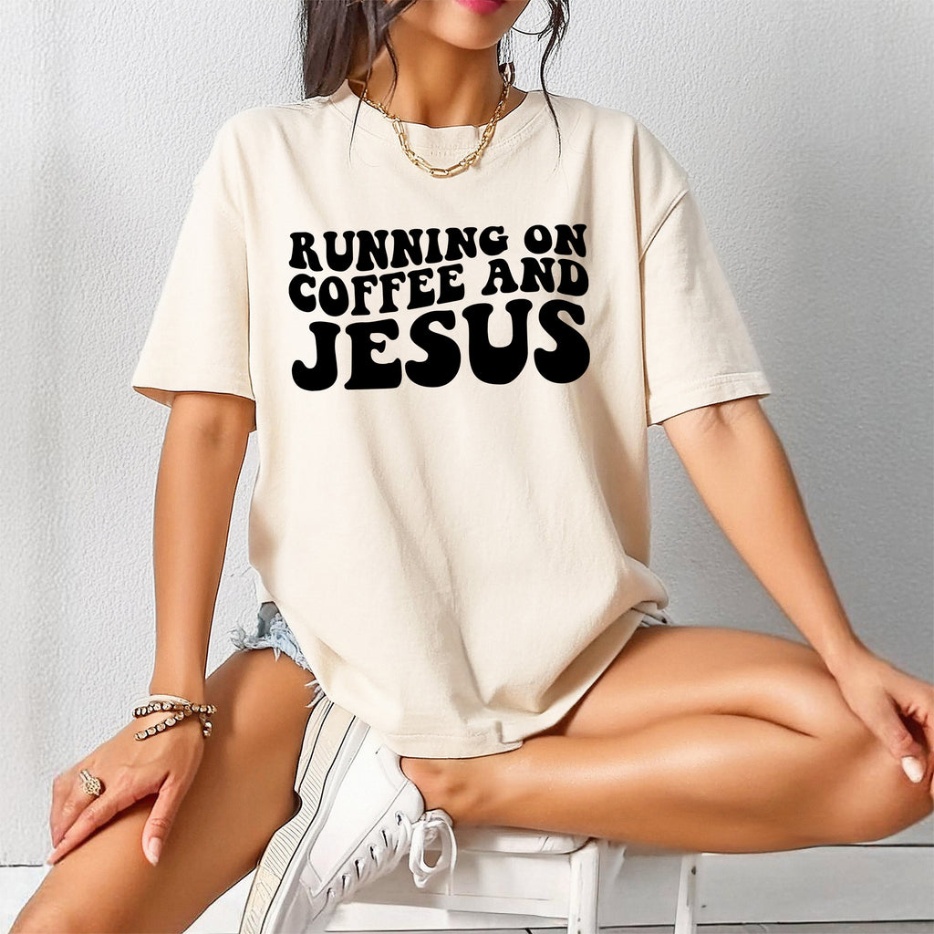 Cream graphic T-shirt with black RUNNING ON COFFEE AND JESUS lettering