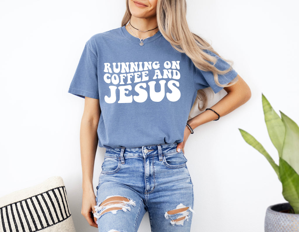 Blue Christian graphic t-shirt with Running on Coffee and Jesus front print
