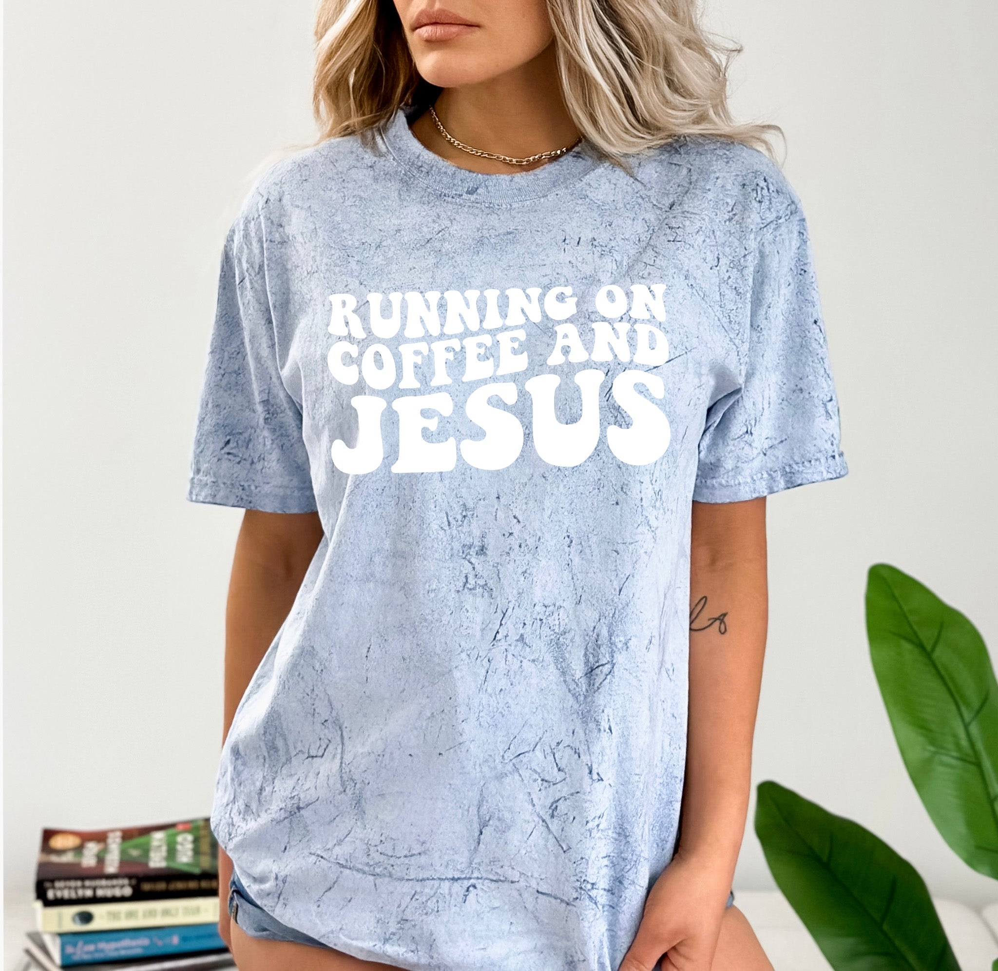 Blue heather graphic T-shirt with RUNNING ON COFFEE AND JESUS lettering