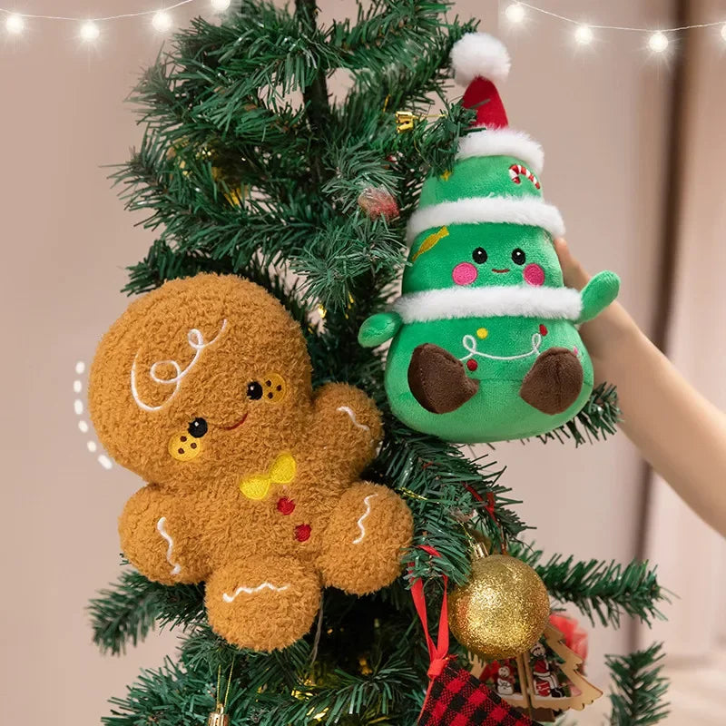 Christmas plush tree and gingerbread plush on an evergreen branch