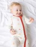 Bamboo footed onesie with sailboat print, red zip-front and cuffs, long sleeves