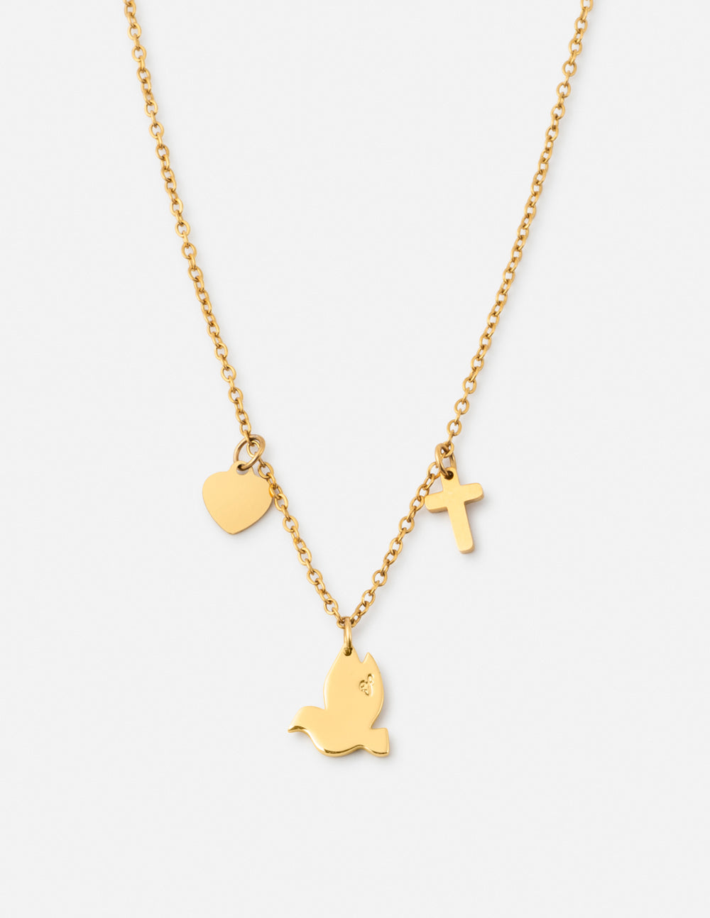 Gold-tone charm necklace with heart, cross, and dove charms on a thin chain