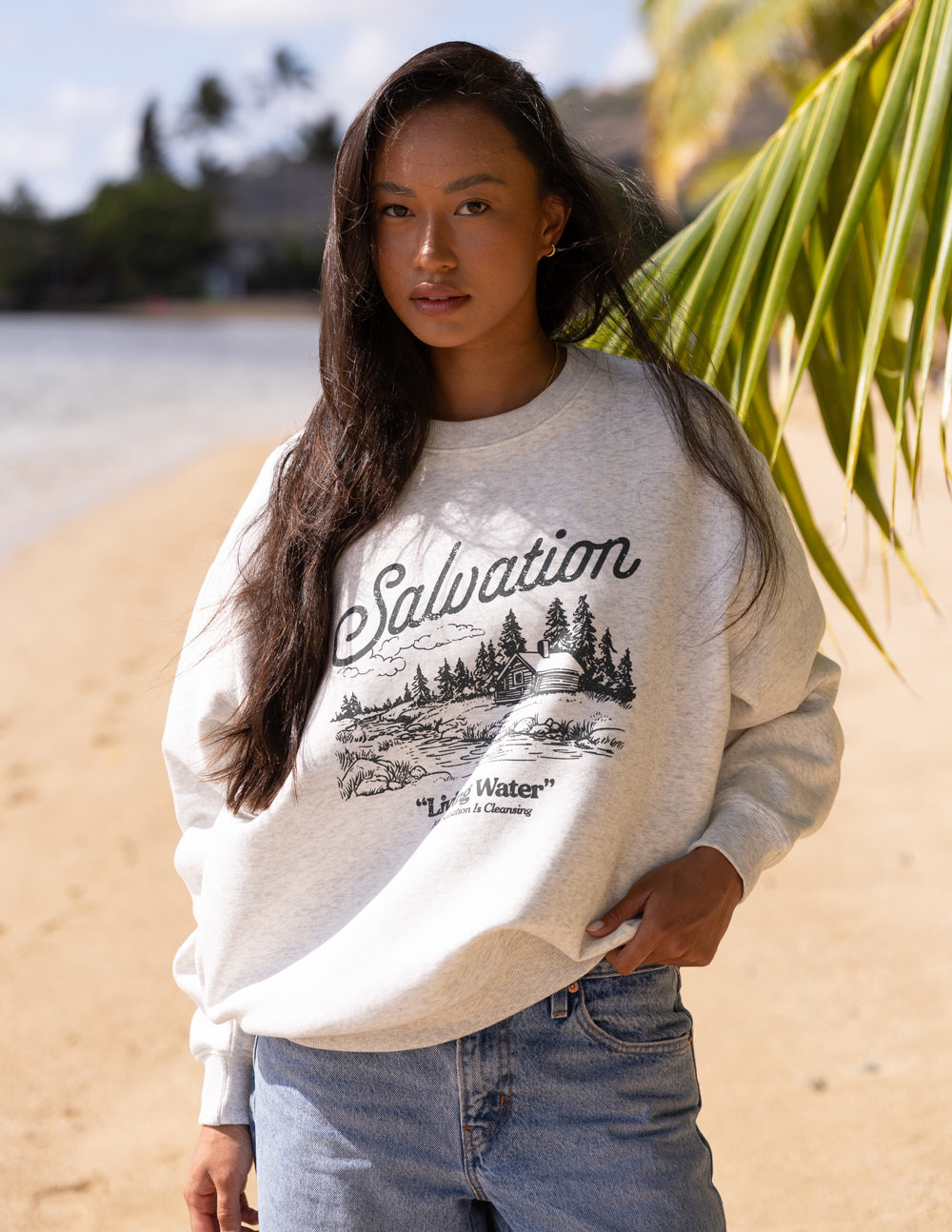 Heather gray crewneck sweatshirt showing Salvation “Living Water” graphic