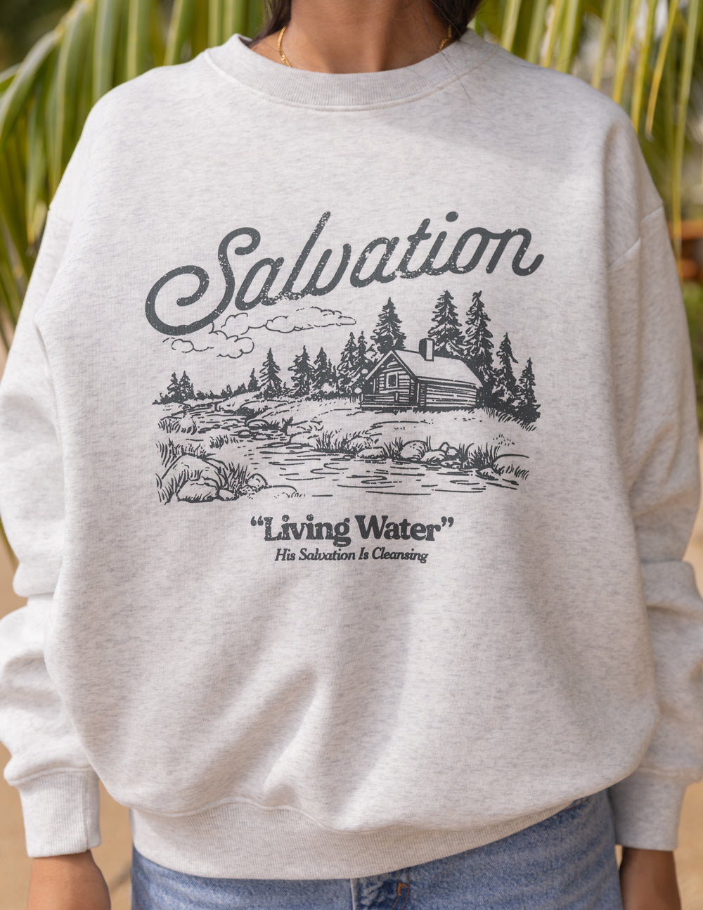 Heather gray crewneck sweatshirt front with Salvation and “Living Water” print