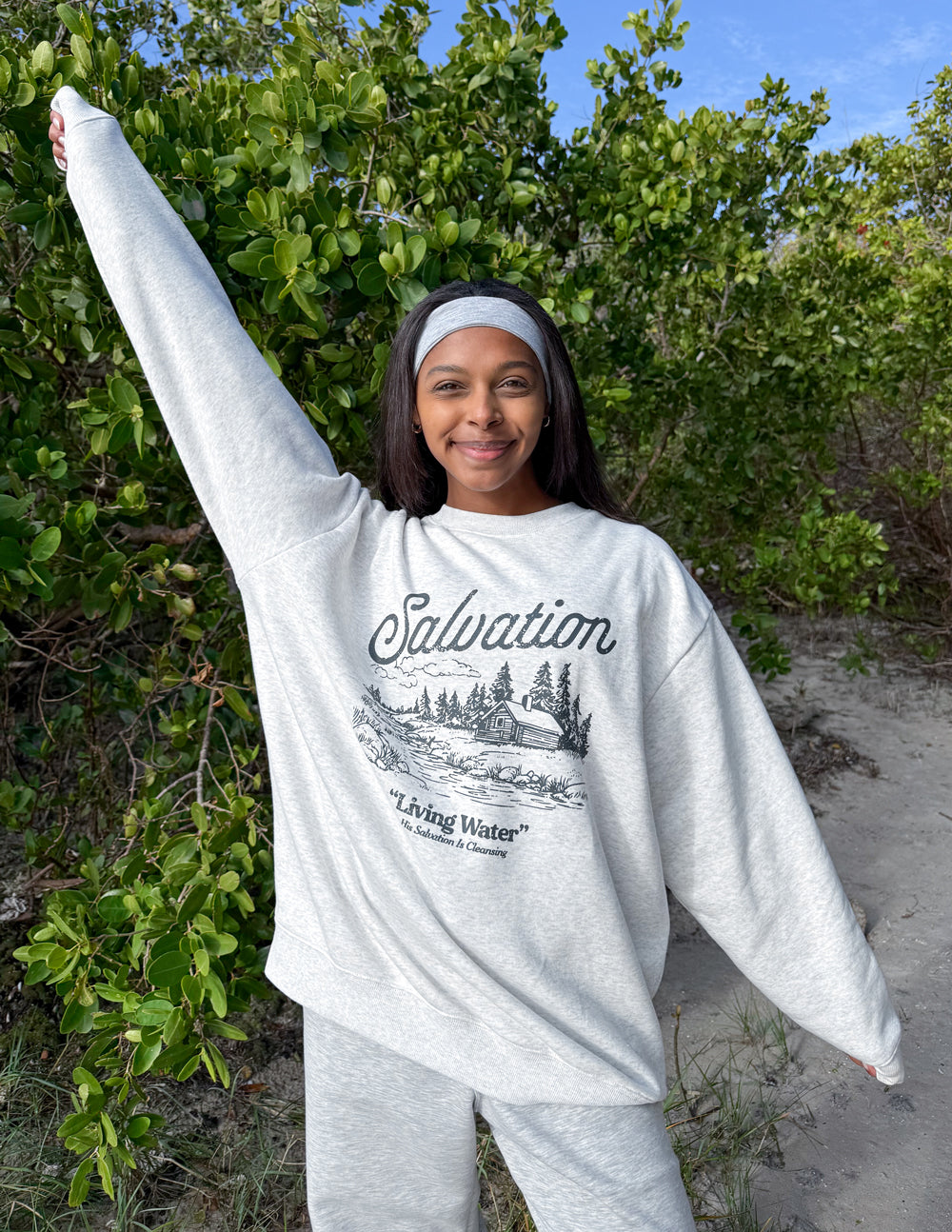 Heather gray crewneck sweatshirt with Salvation “Living Water” front graphic
