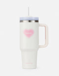 White 40 oz tumbler with pink heart logo, silver lid, and clear straw