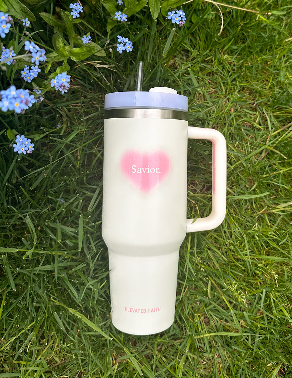 White 40 oz tumbler with pink heart logo, silver lid, straw, and side handle