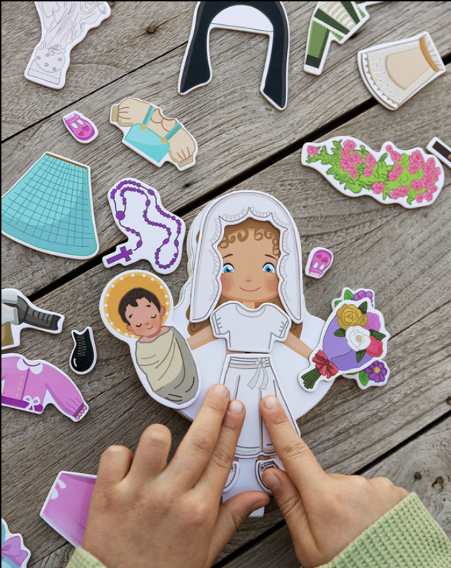Magnetic wooden dress-up doll set with girl figure and colorful clothing pieces