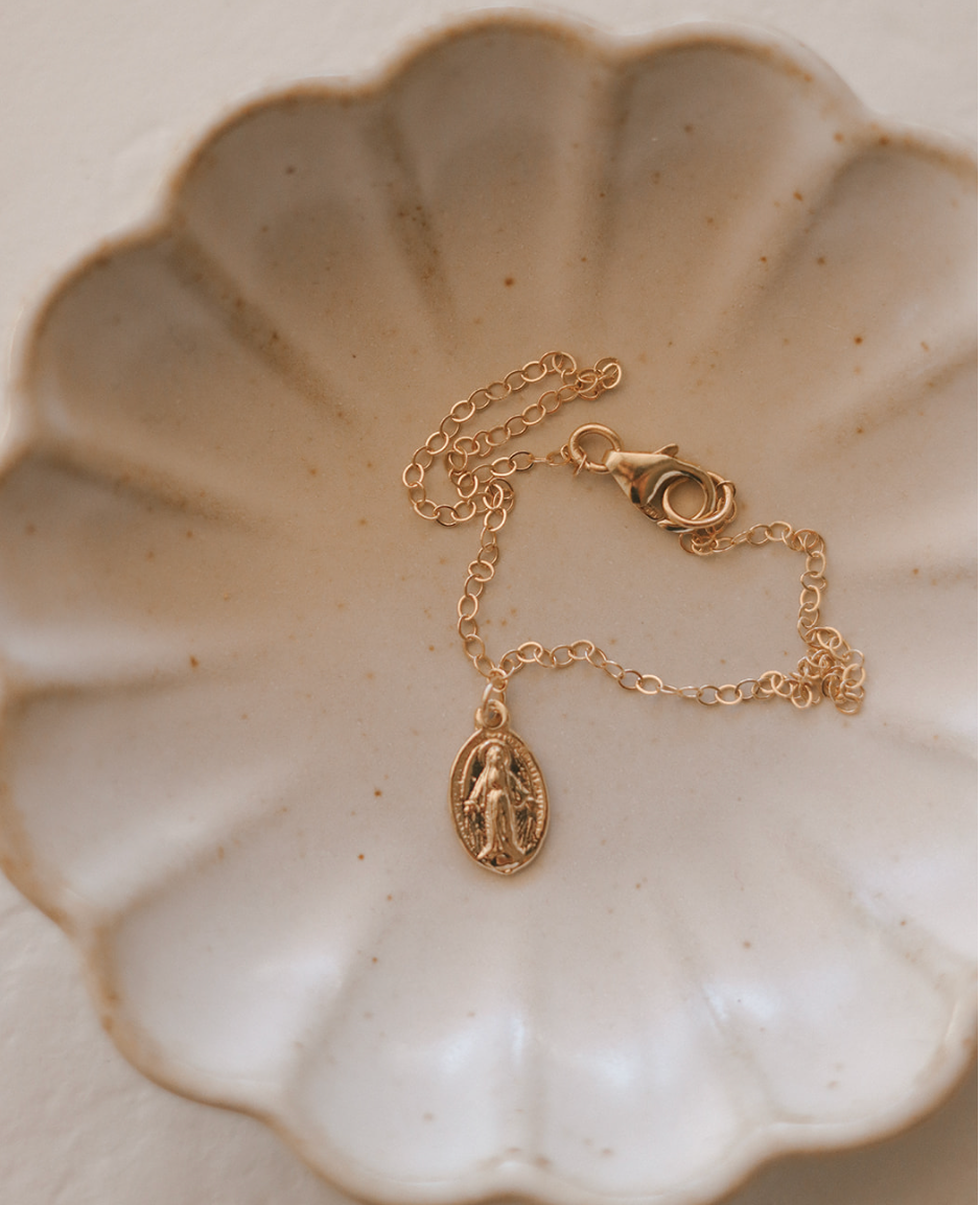 14K gold bracelet with adjustable clasp and oval miraculous medal pendant