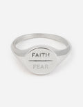 Silver faith over fear signet ring with 'FAITH' and 'FEAR' engraving on face