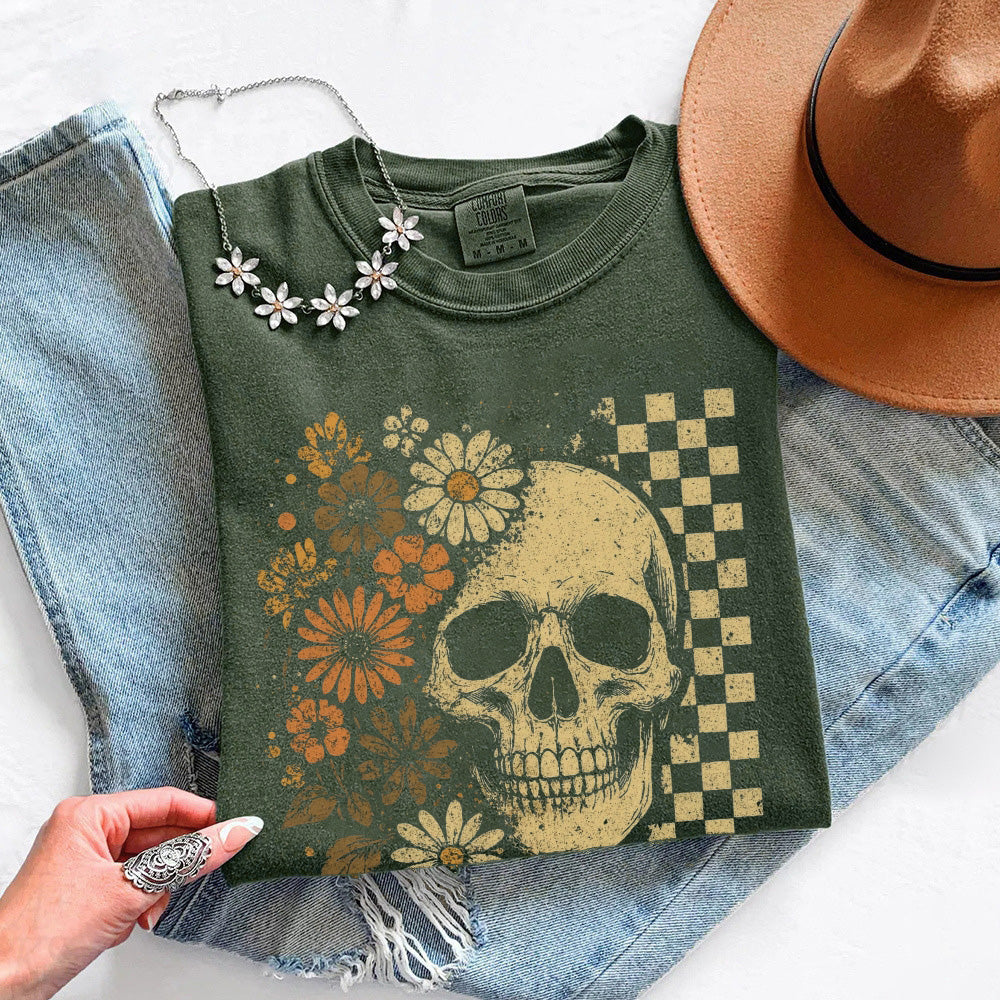 Dark green T-shirt with gold skull, orange flowers, and checkered side graphic