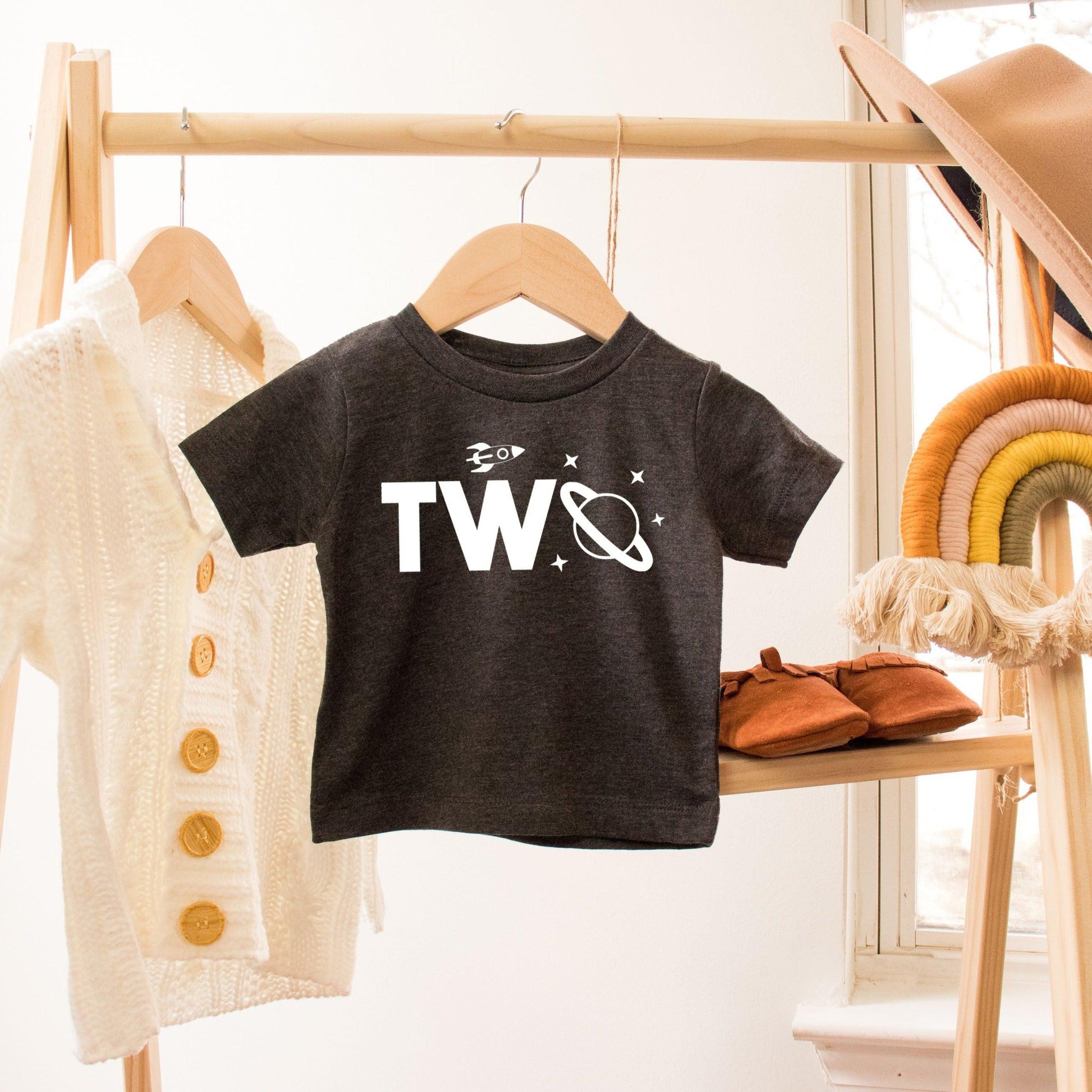 Kids space-themed T-shirt in black with “Two” graphic and small star icons