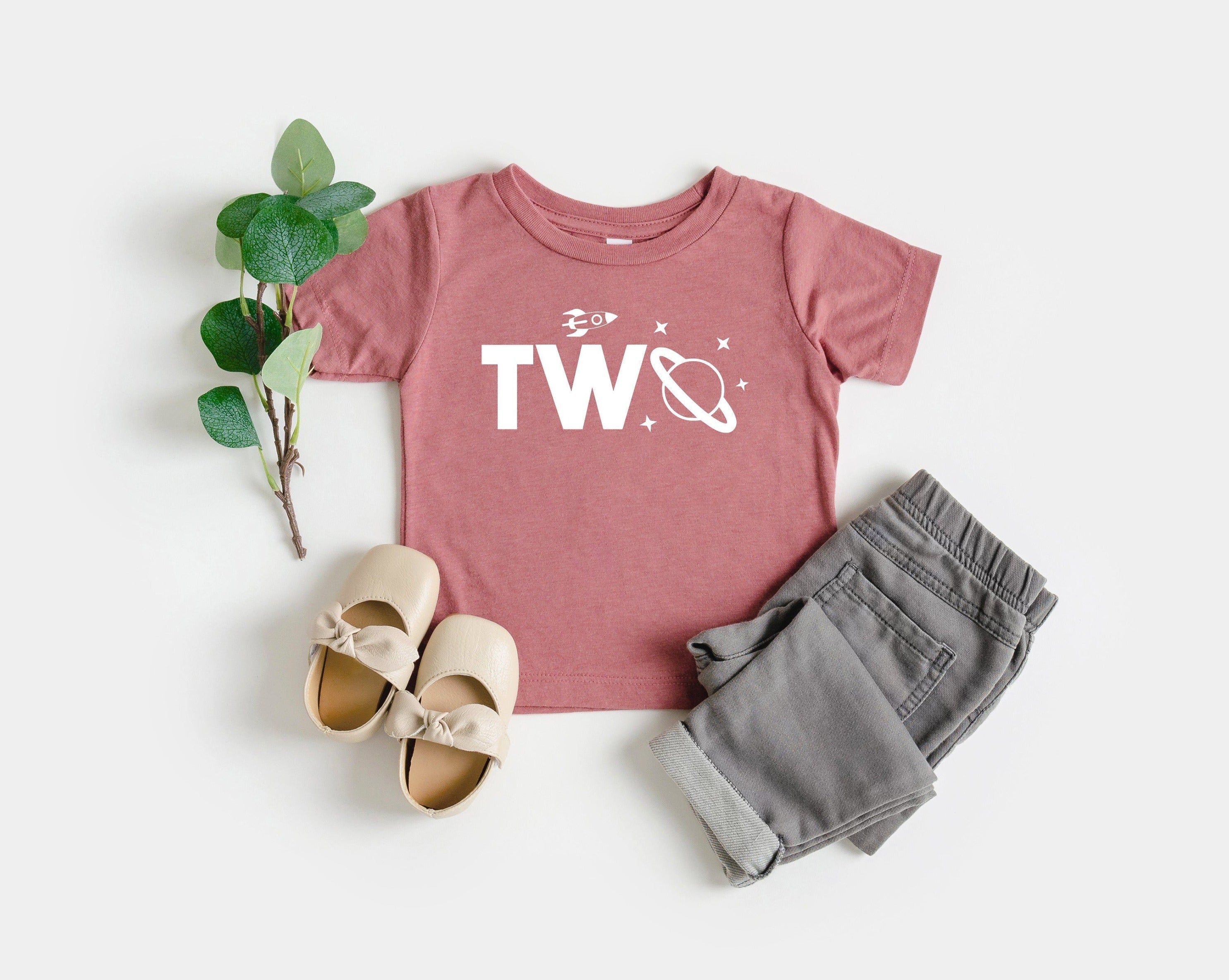 Kids space-themed T-shirt in dusty pink with “Two” graphic and star accents