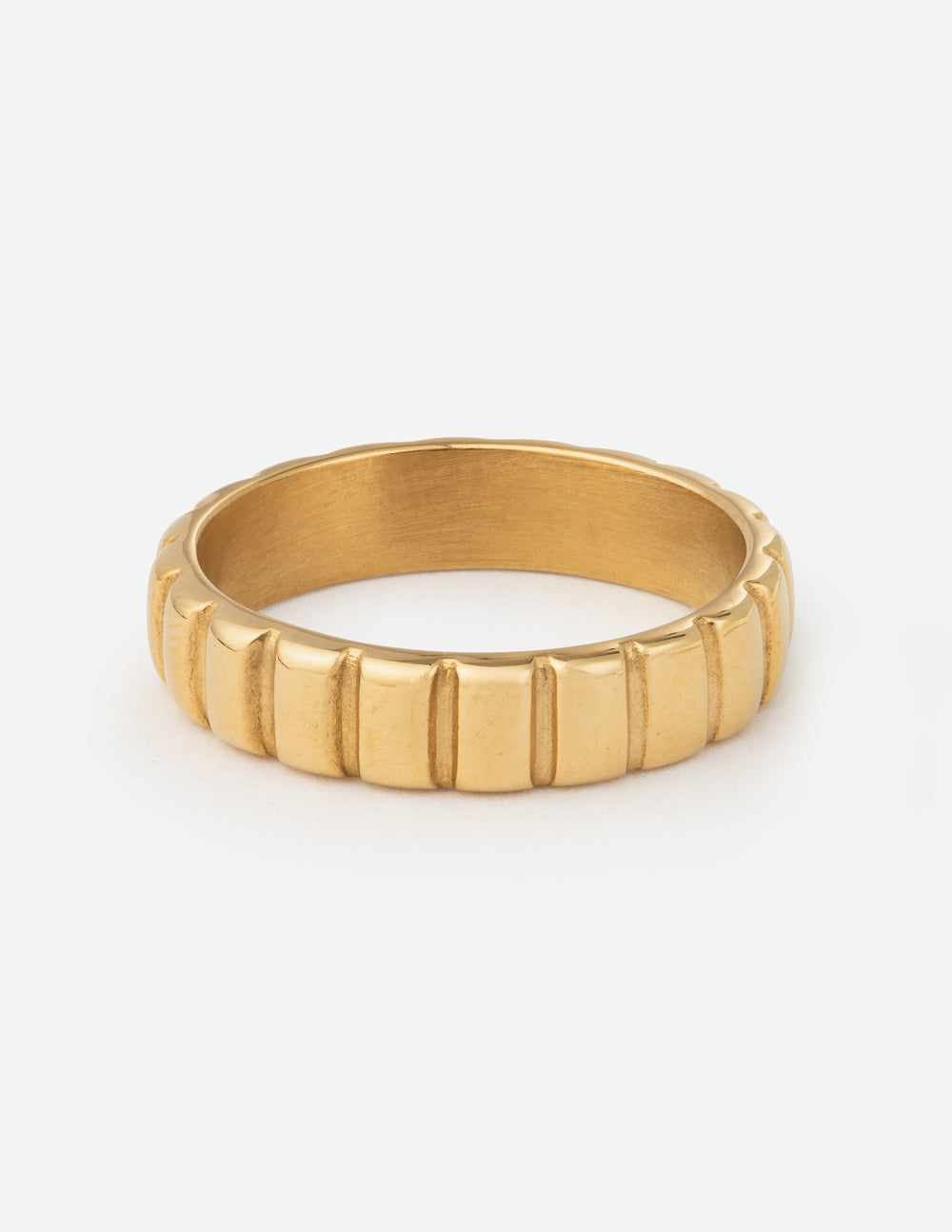 Gold spacer ring with ridged band, centered view