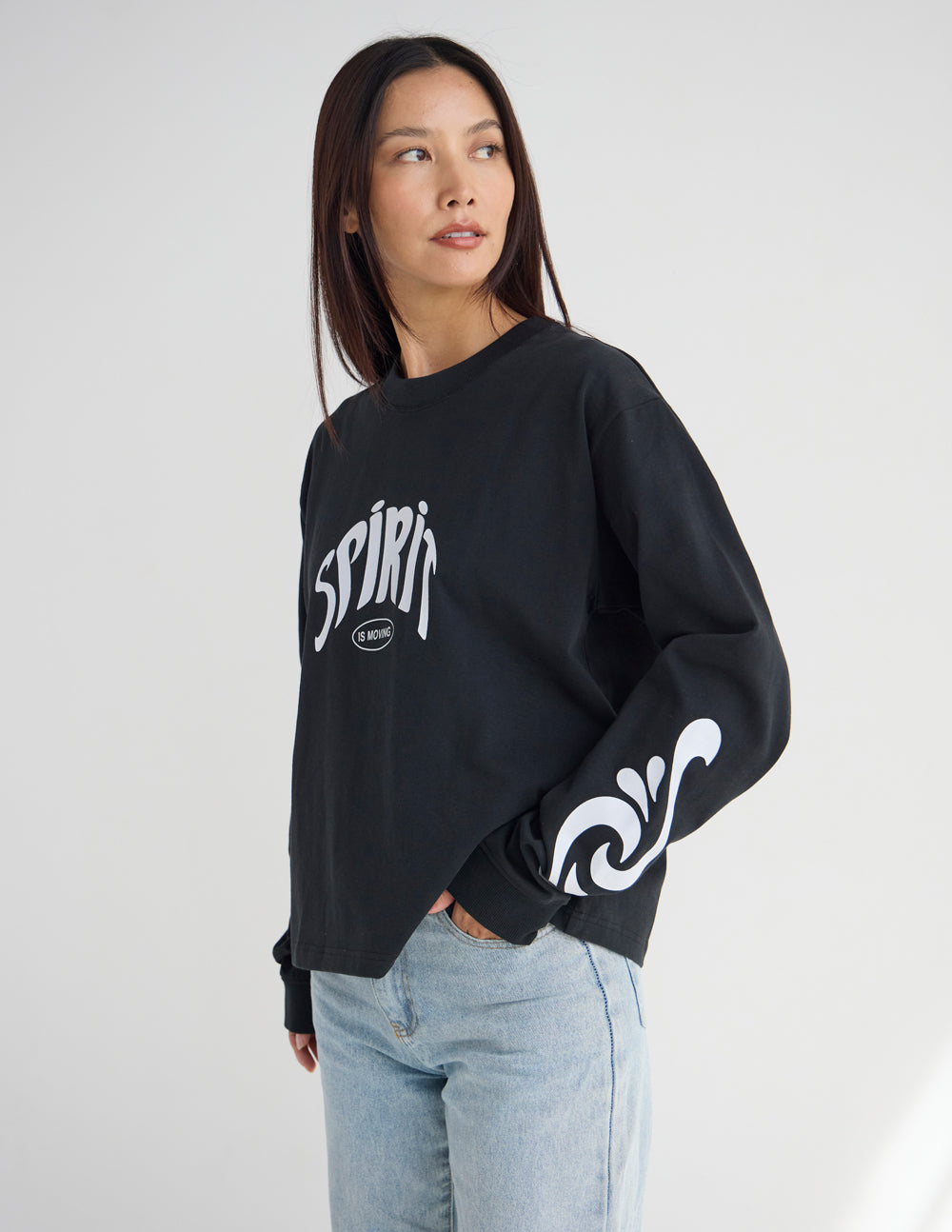 Black long-sleeve heavyweight tee with Spirit front logo and wide graphic sleeve.