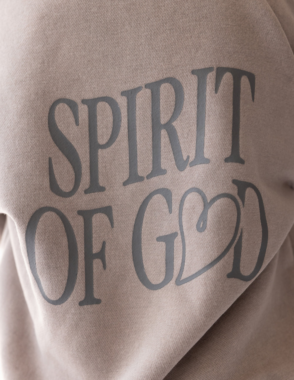Kids taupe hoodie back graphic close-up: “SPIRIT OF GOD”