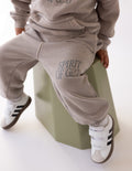 Kids taupe sweatpants with drawstring and cuffed legs, Spirit of God print