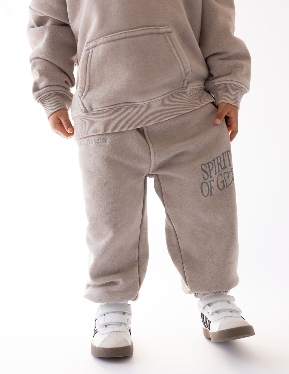 Kids taupe sweatpants with front pocket and Spirit of God logo on leg