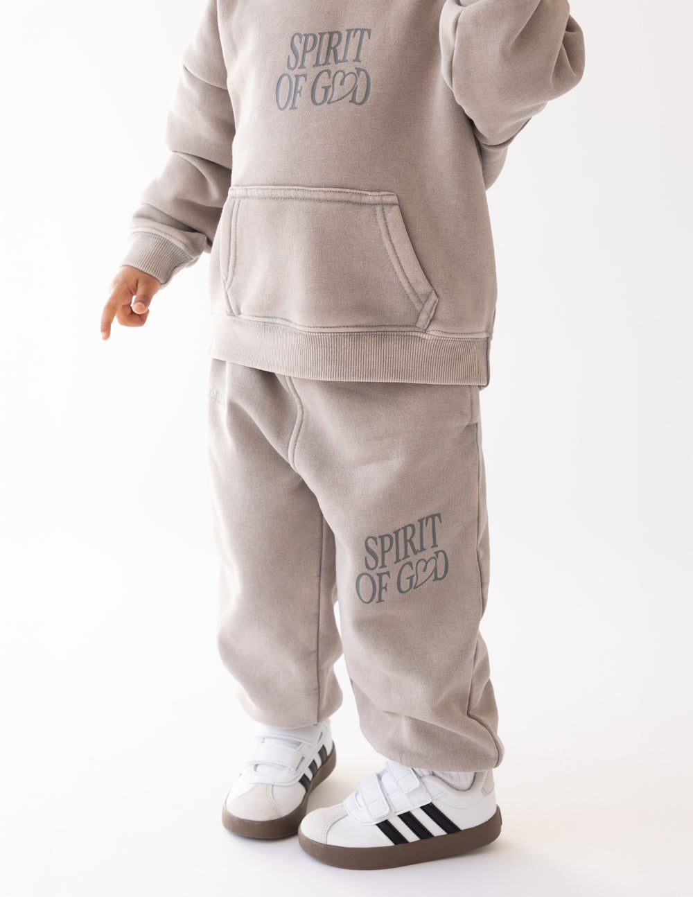 Kids taupe sweatpants with pocket seam and Spirit of God logo on leg