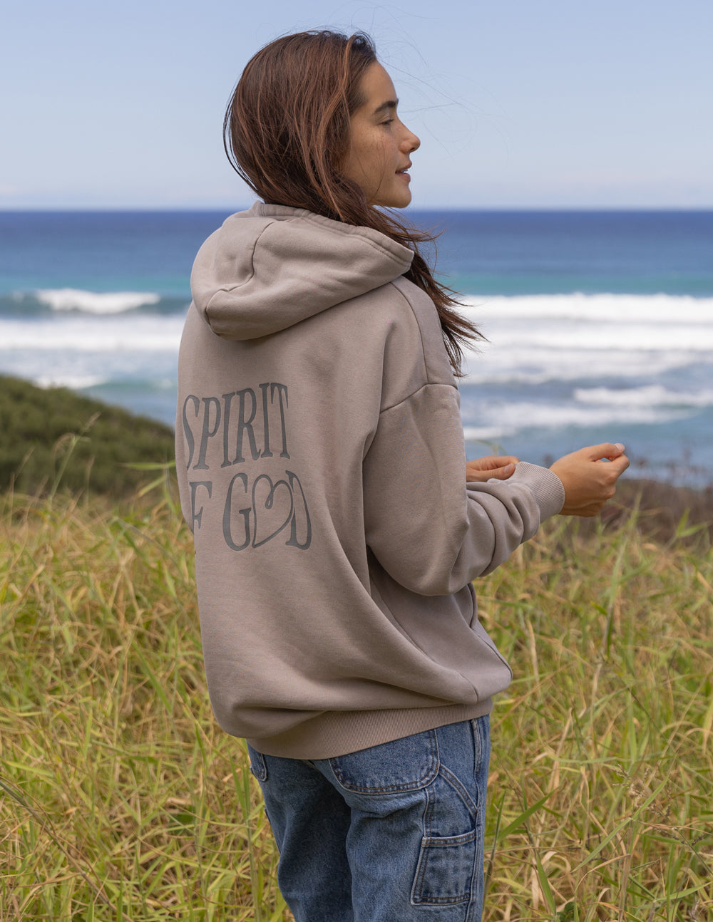 Taupe unisex hoodie side view with 'Spirit of God' back print and pullover hood