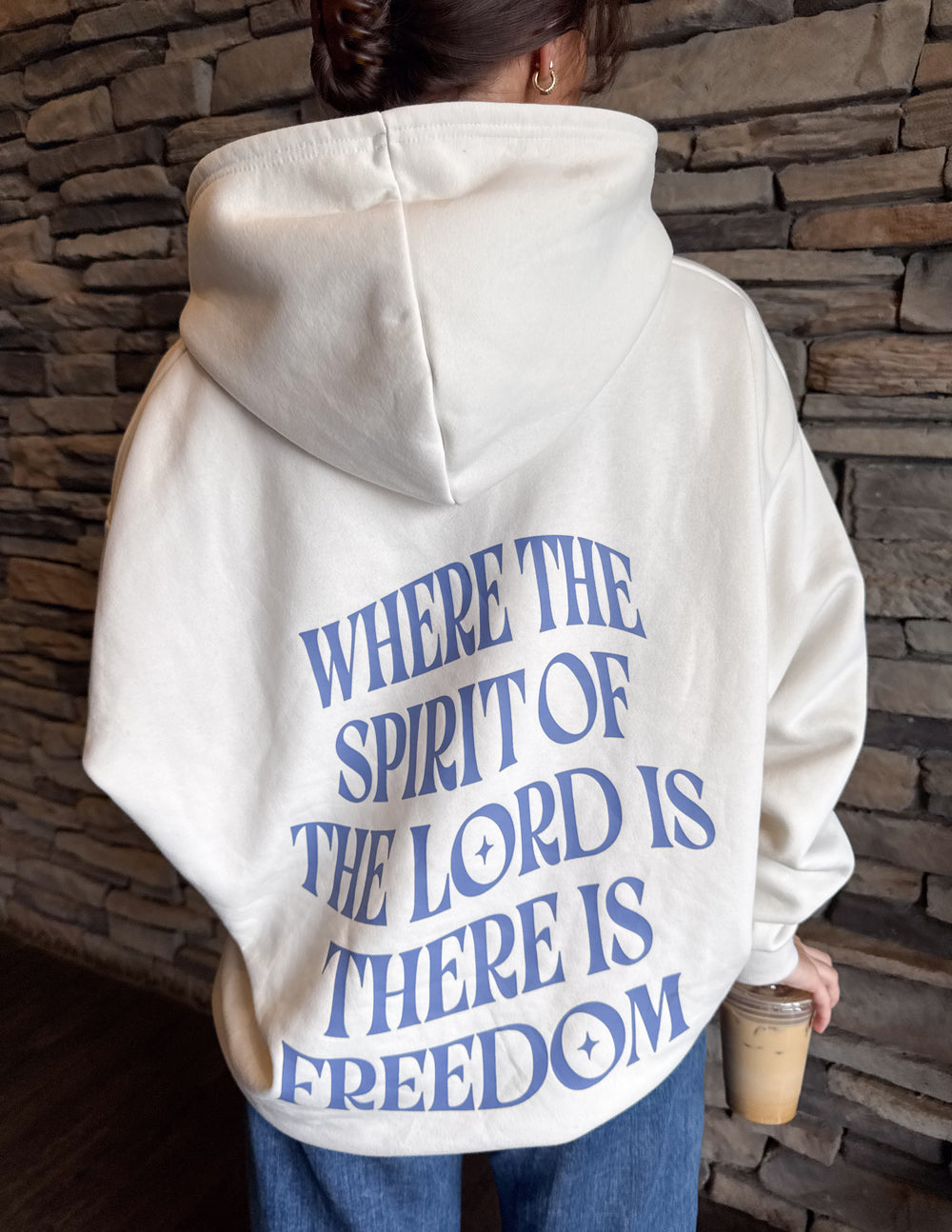 White unisex hoodie with blue 'Freedom' graphic on back, pullover hood.
