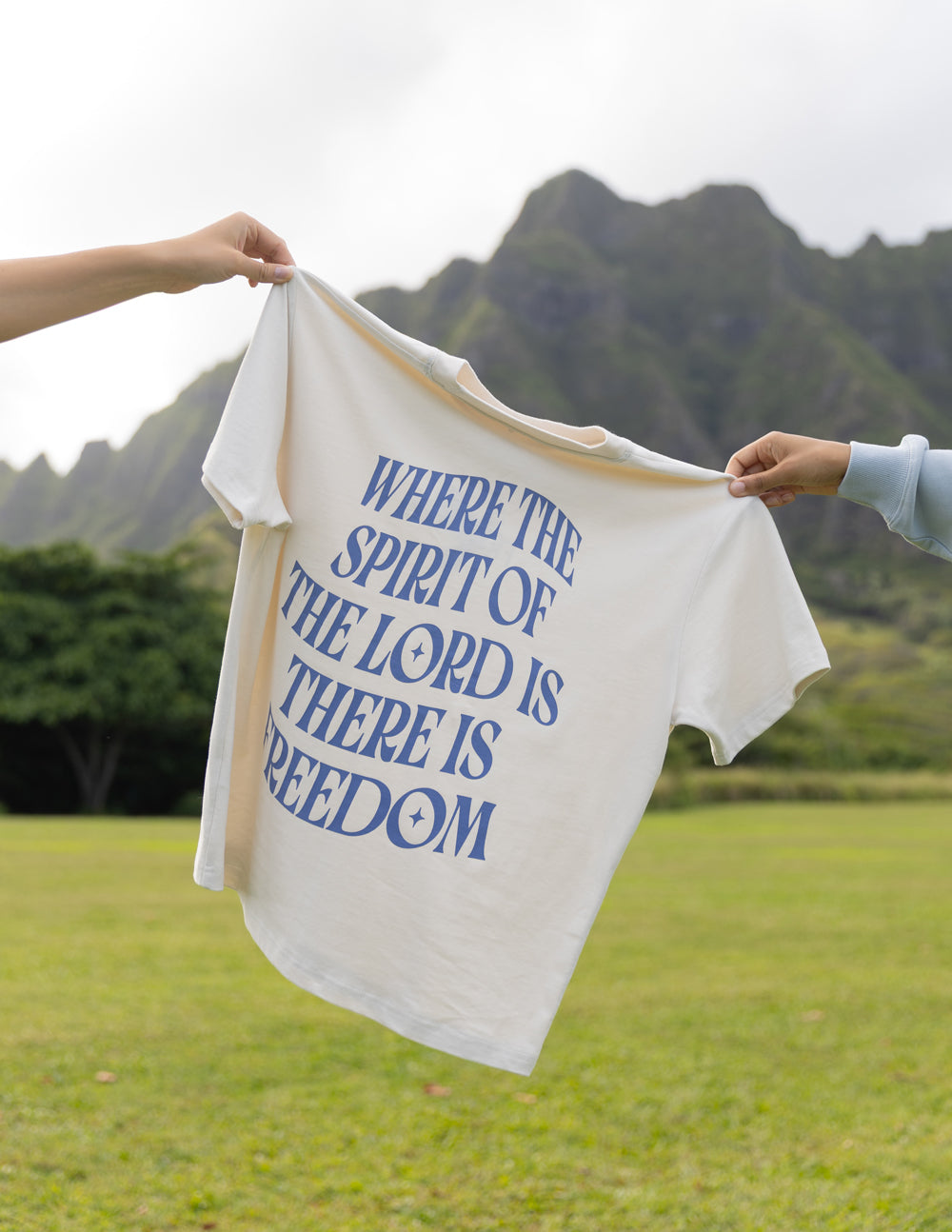 White unisex T-shirt with blue quote graphic on front