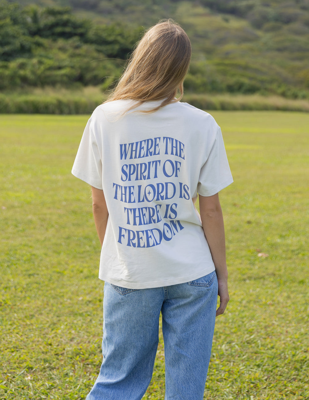 White unisex T-shirt, back view with blue quote and "FREEDOM"