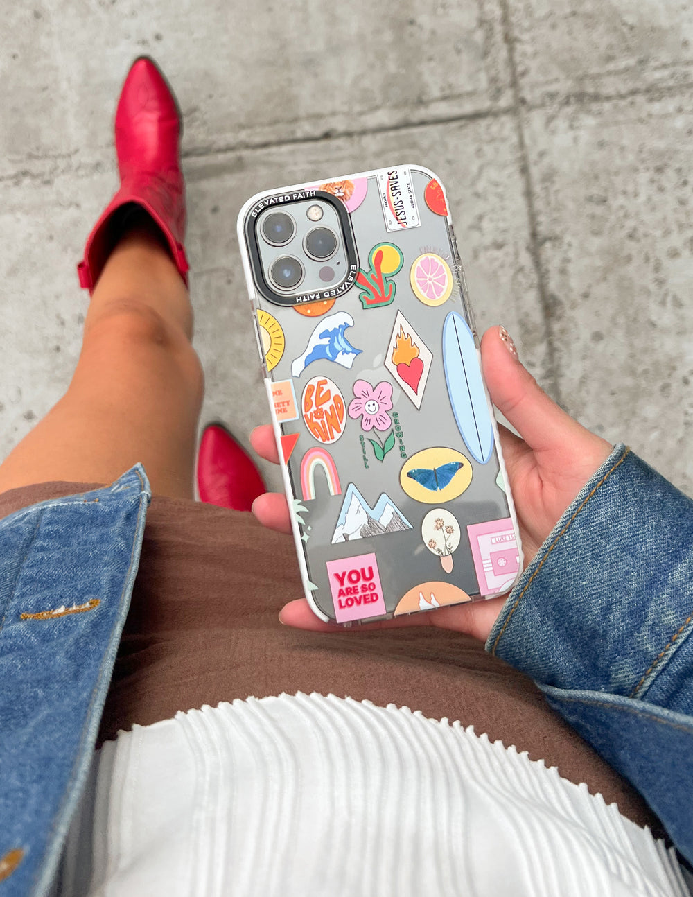 Phone case with sticker collage artwork, light base, dual camera and flash cutouts