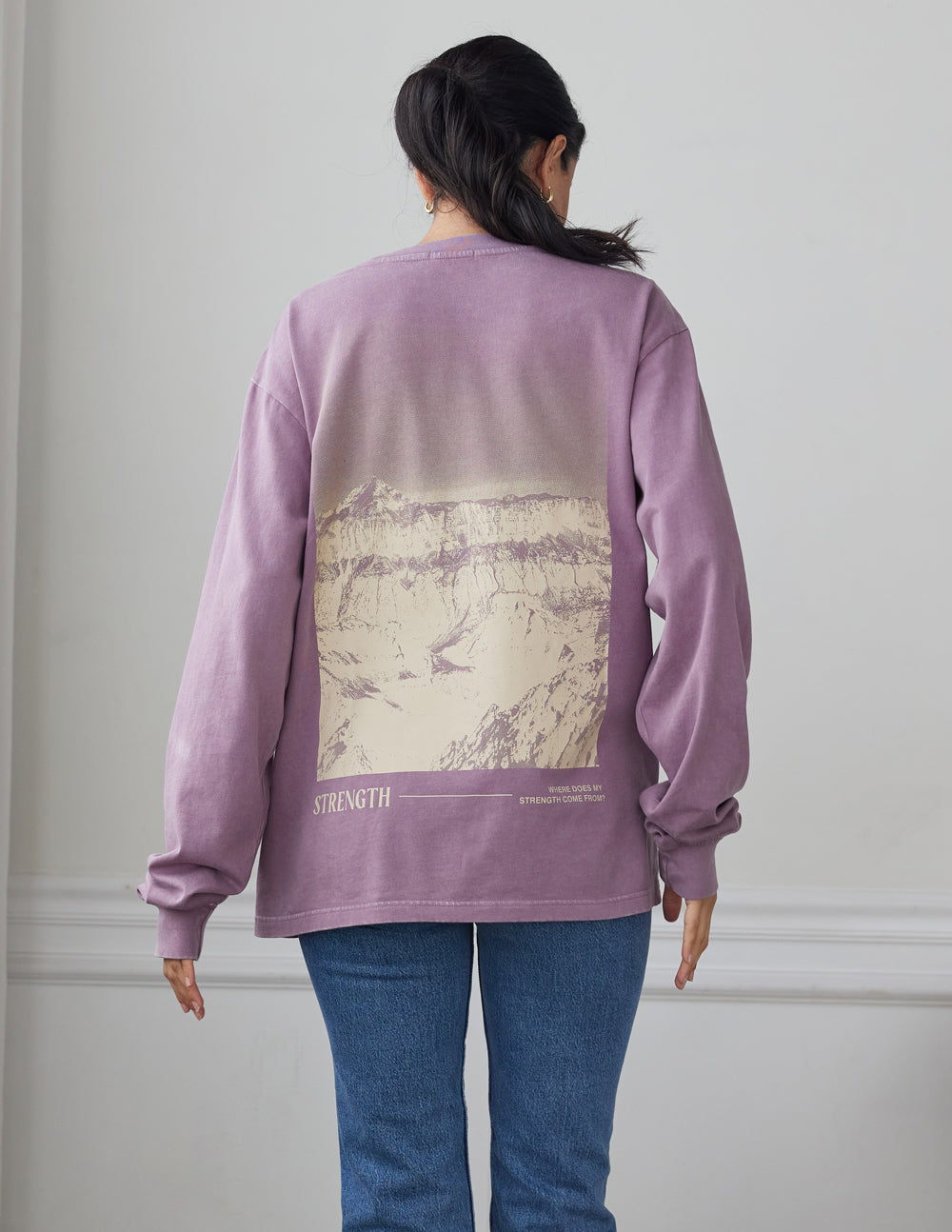 Lavender long-sleeve unisex T-shirt with central back graphic and text